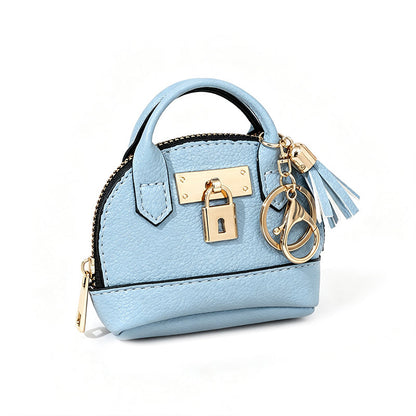 🔥 ¡50% OFF POR TIEMPO LIMITADO! 👜 Llavero de Bolso Mini Forma de Concha – Elegante, Práctico y con Detalles de Lujo ✨